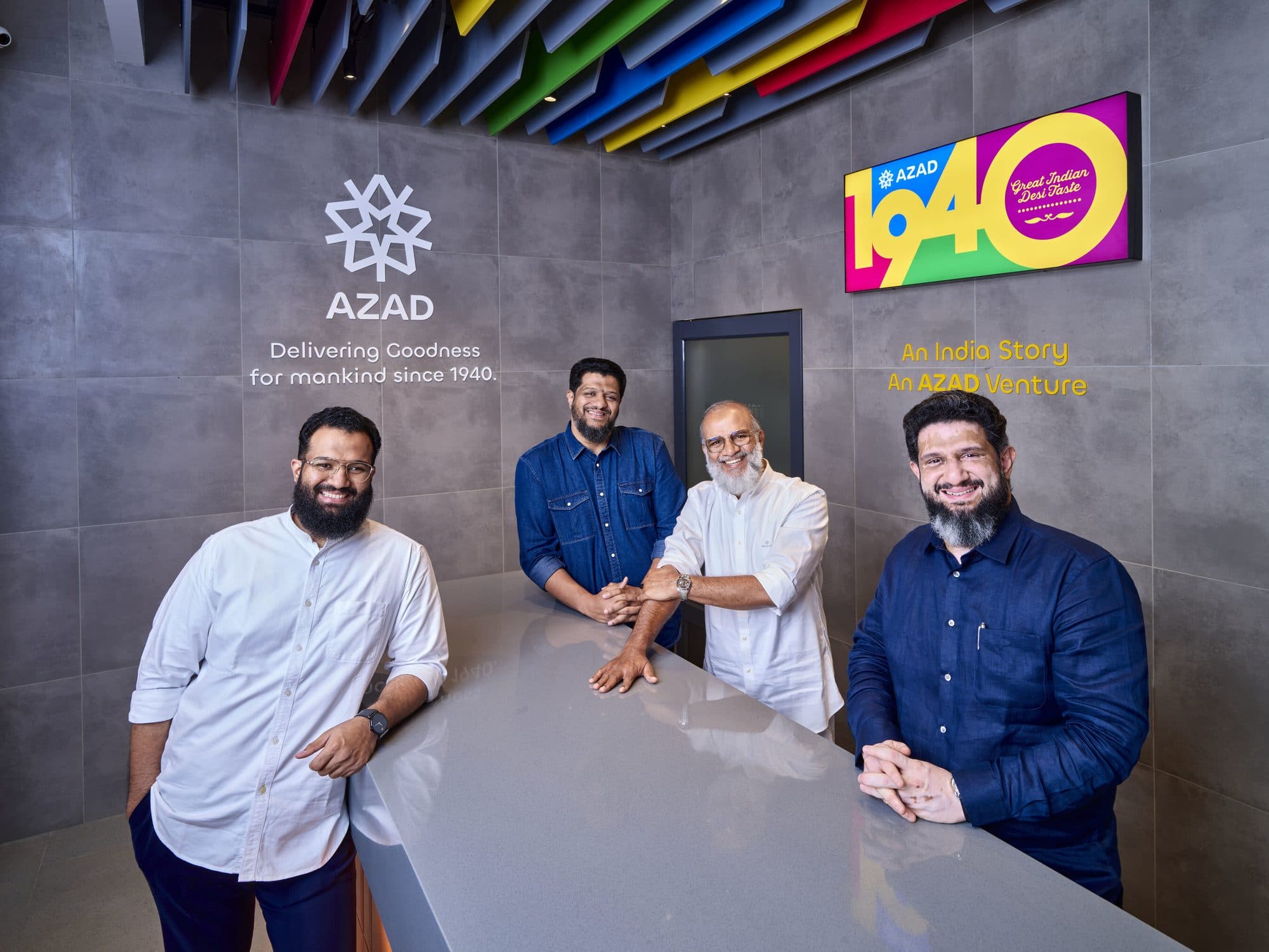 Azad family leadership smiling at a 1940 India by Azad counter under Great Indian Desi Taste branding
