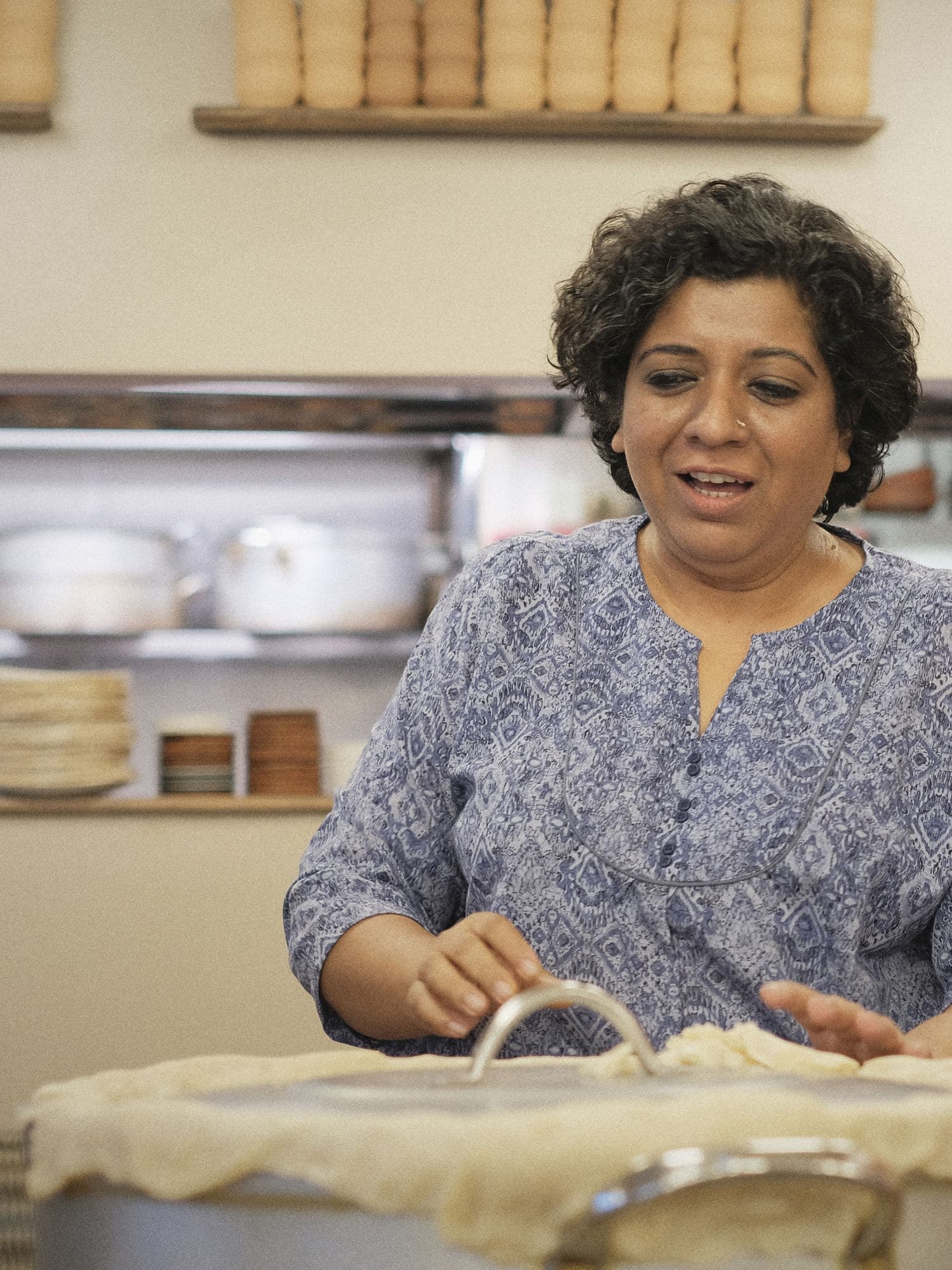 Asma Khan in the kitchen at Darjeeling Express, about to open a Calcutta-style dum biryani