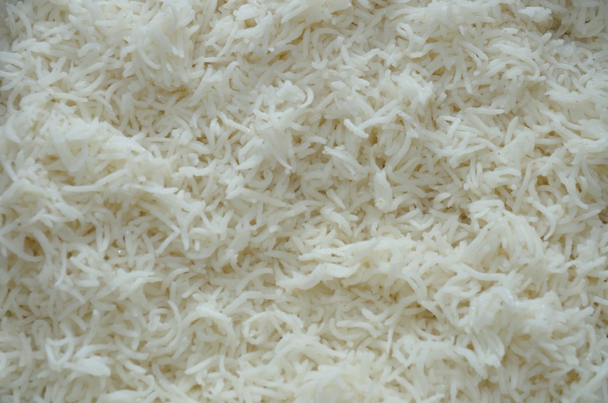 Cooked basmati rice, long white grains separate and glossy