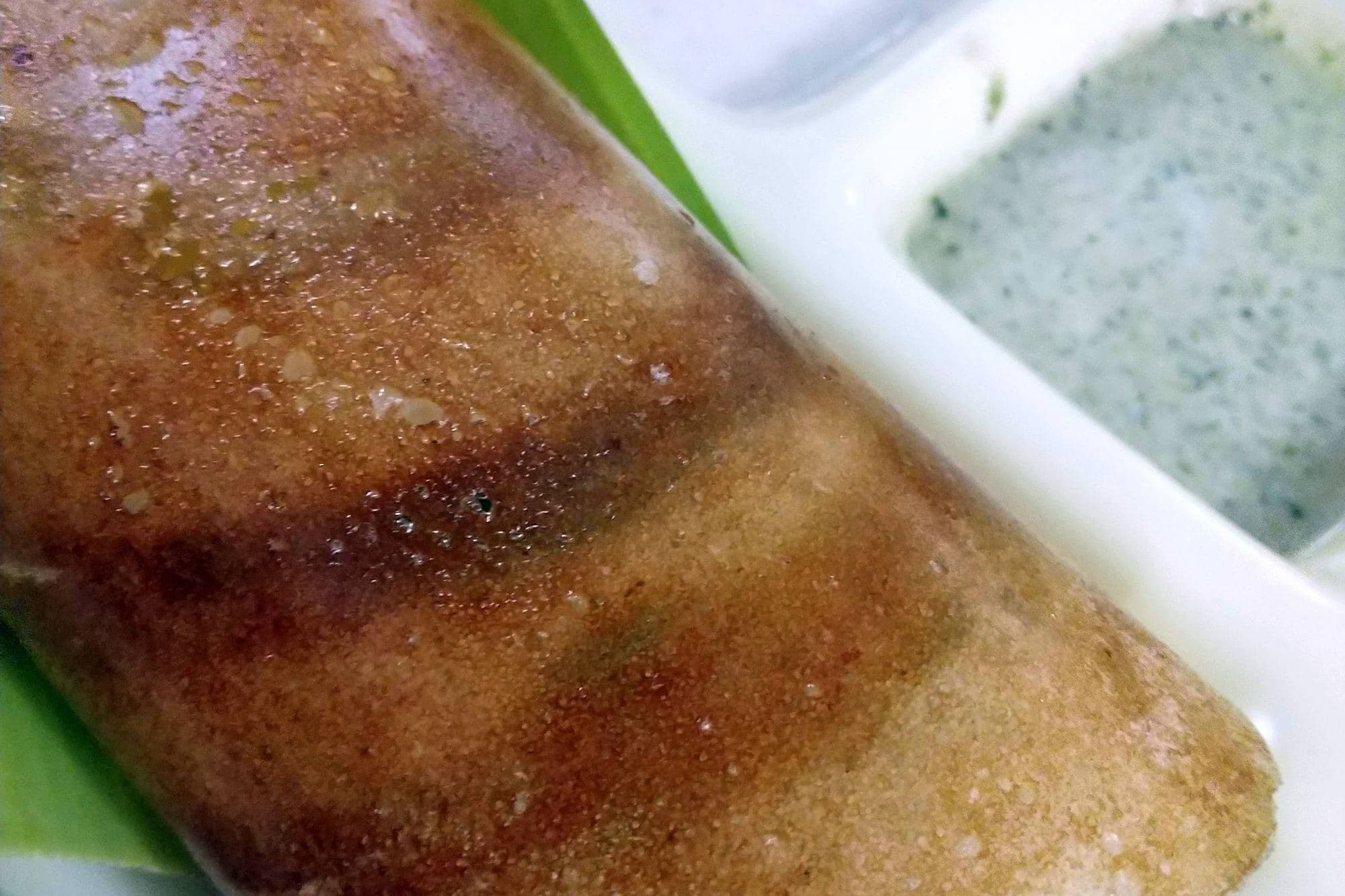 Ghee masala dosa at CTR Shri Sagar in Bangalore, folded on a steel plate with chutney