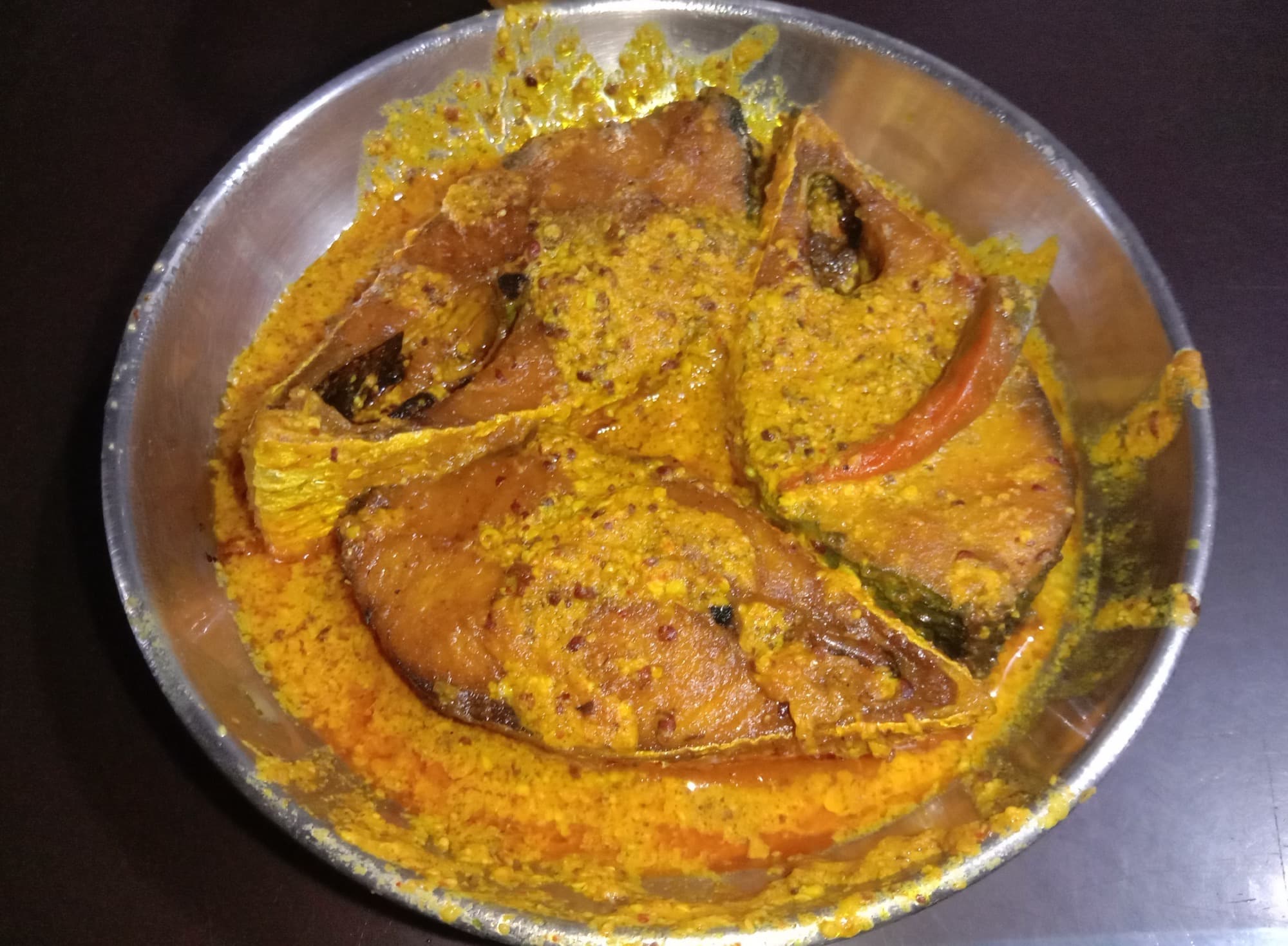 Homemade shorshe ilish (mustard hilsa) in a Bengali household, West Bengal