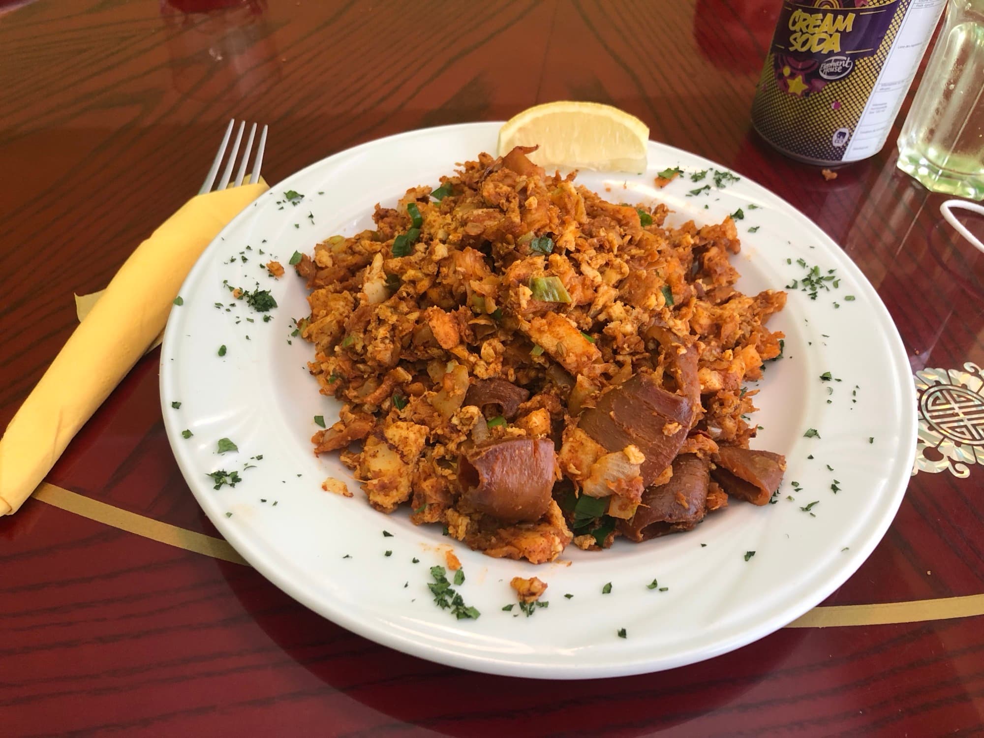Plate of kottu roti with seafood, a Sri Lankan chopped-roti stir-fry